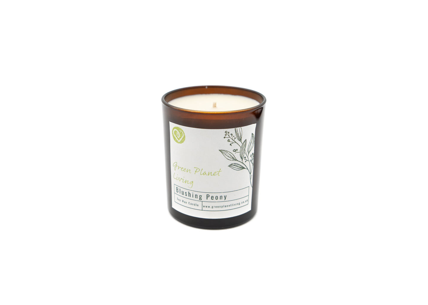 plant based wax candle in an amber jar on a white background with the green planet living logo
