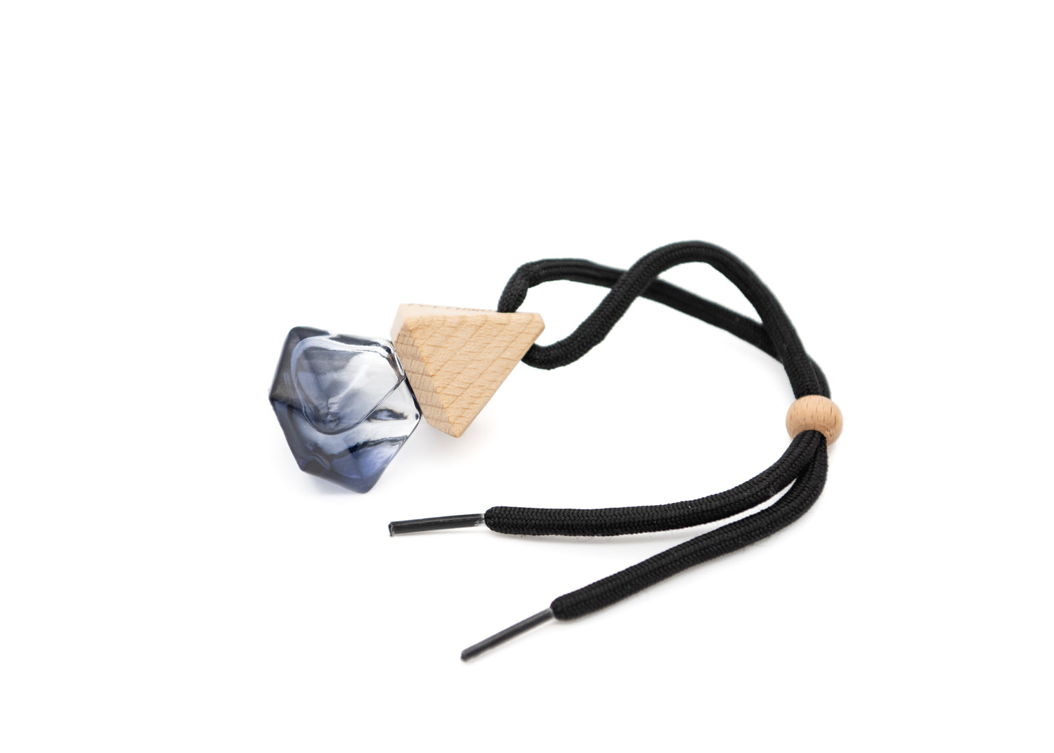 refillable car air fresher, black amber base, wooden top and black shoestring. Placed on a white background