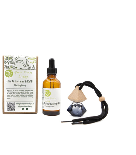 refillable car air freshener with refill bottle and eco-friendly recycled packaging on a white background