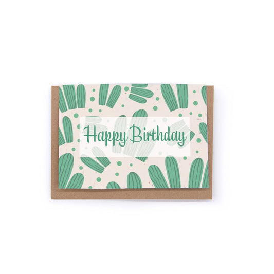 a cactus themed birthday card, printed on hand made seed paper. card is sitting in front of a recycled kraft envelope