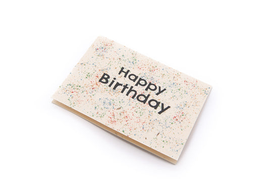 Luxury sustainable birthday card made from handmade UK wildflower seed paper, featuring colorful eco-friendly design and recycled kraft envelope.