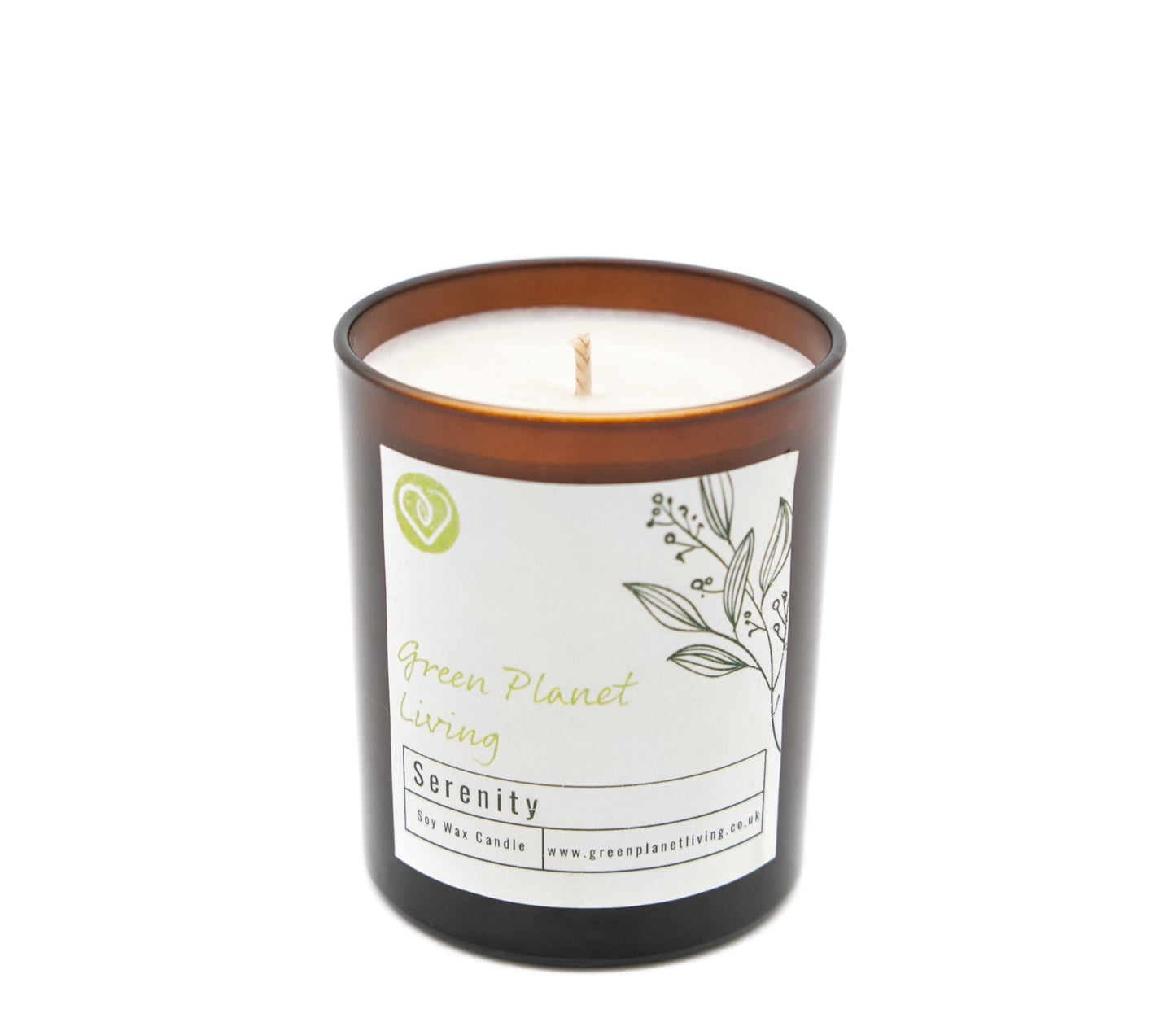 green planet living serenity candle in amber jar on white background