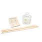 REED DIFFUSER OPEN CARE CARDC, DIFFUSER BOTTLE AND NATURAL REED ON WHITE BACKGROUND