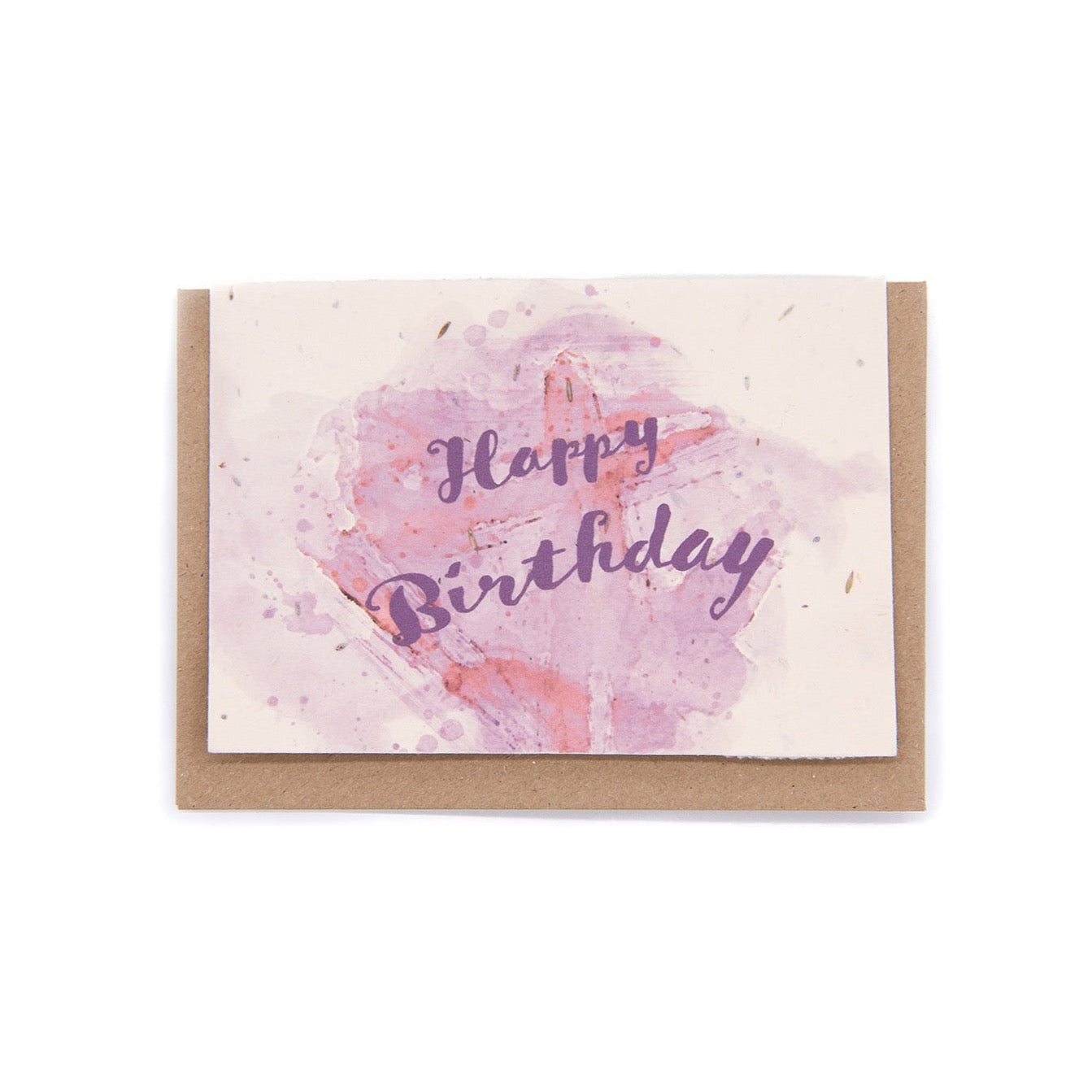 Handmade wildflower seed paper birthday card with pink and purple watercolor design, featuring "Happy Birthday" text, eco-friendly and plantable, paired with recycled kraft envelope.